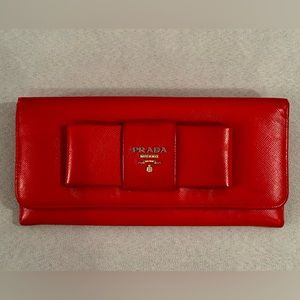 Prada Saffiano Continental Wallet. Bow snap design. Vivid red